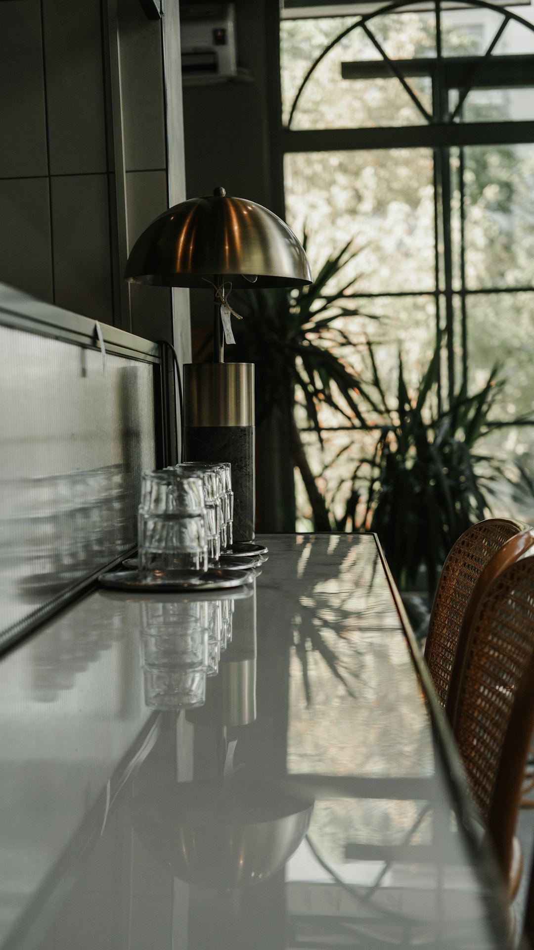 a-kitchen-with-a-table-and-chairs-next-to-a-window-tgrjipoope4
