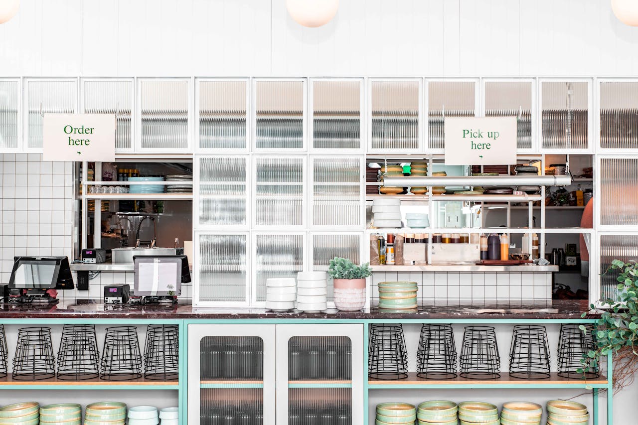 Contemporary restaurant counter with modern design and empty dinnerware.
